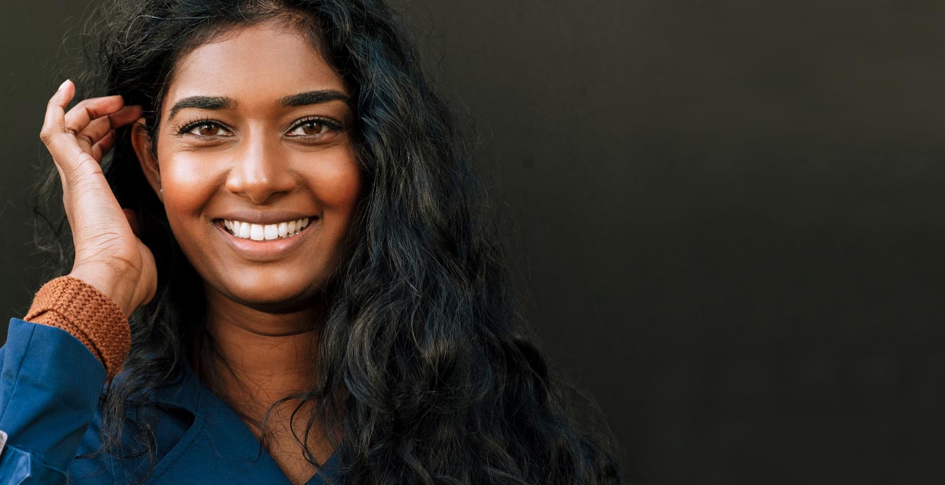 Smiling woman with long dark hair