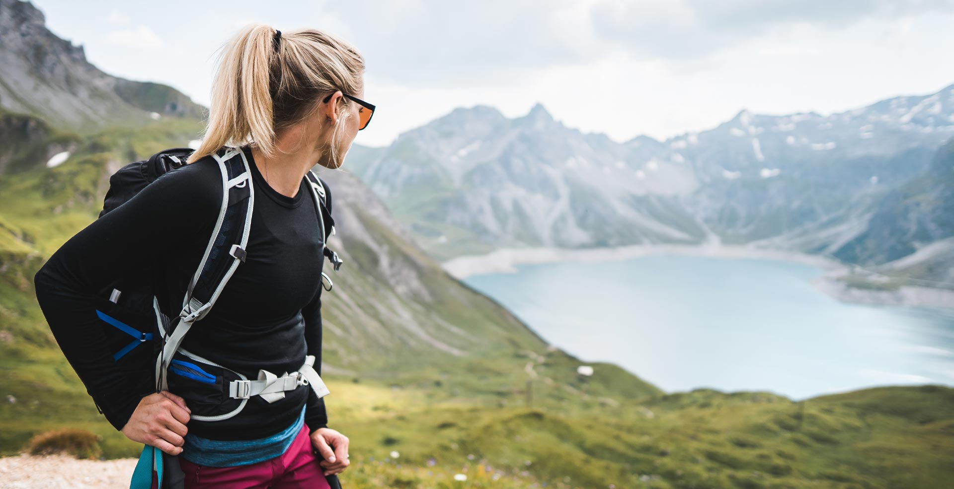 Woman hiking looking at lake